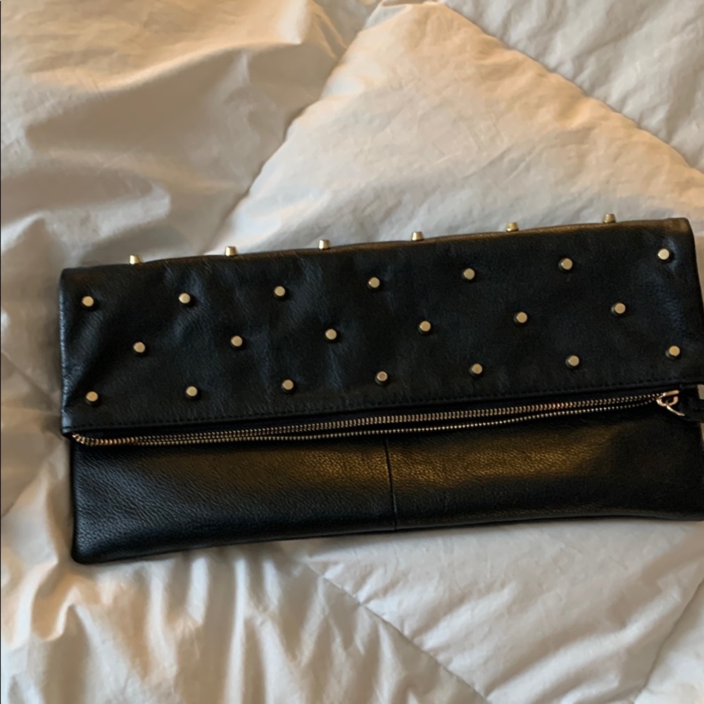Studded BCBGmaxazria Clutch. Magnetic close and zipper.